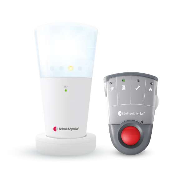 Bellman & Symfon Visit alert system featuring a white cylindrical flash receiver with a glowing top and a remote transmitter with icons for door, phone, and fire alerts, including a large red emergency button. Isolated on a white background.