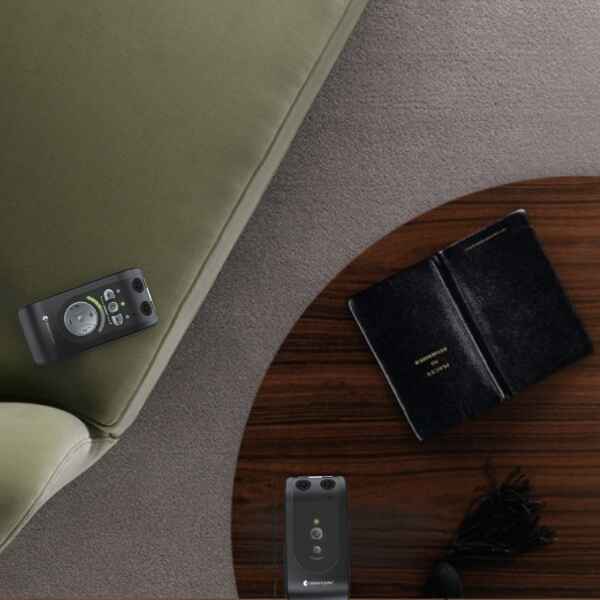 Personal Hearing Amplifier Displayed in Business Meeting